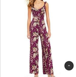 Floral purple jumpsuit by GB. Size Small
